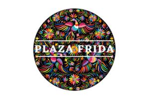 A circular logo with colorful, intricate floral and bird patterns, featuring the words PLAZA FRIDA in bold white letters across the center.