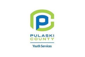 Logo for Pulaski County Youth Services, featuring a stylized blue letter P inside a green C, with the text Pulaski County Youth Services beneath the logo.